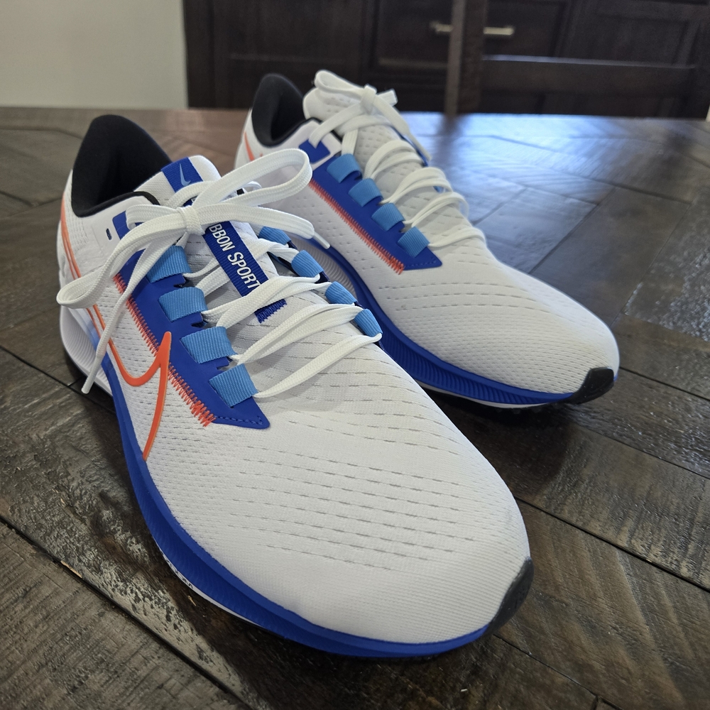 Nike White and Blue Athletic Shoes with Orange Detail